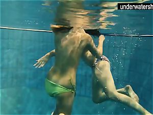 two fabulous amateurs showing their bodies off under water